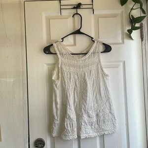 White embroidery open back button tank. Super cute just not my style in the end